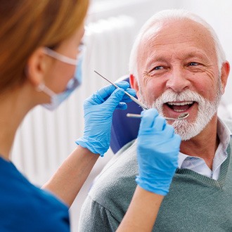 Mature man smiling during dental checkup