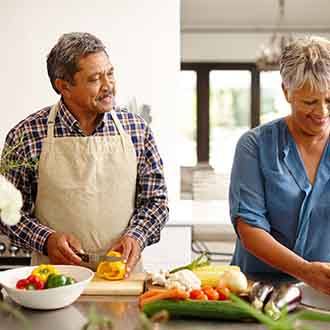 couple preparing healthy foods to eat