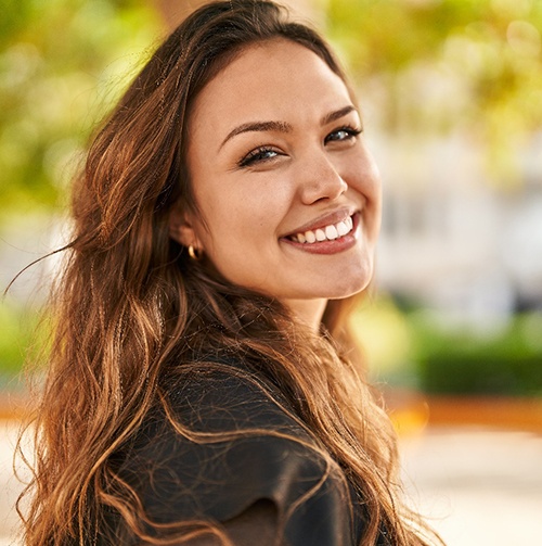 Closeup of woman smiling outside