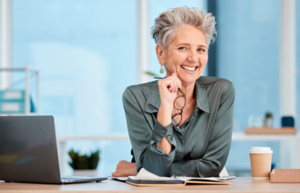 Adult woman smiling while working at desk